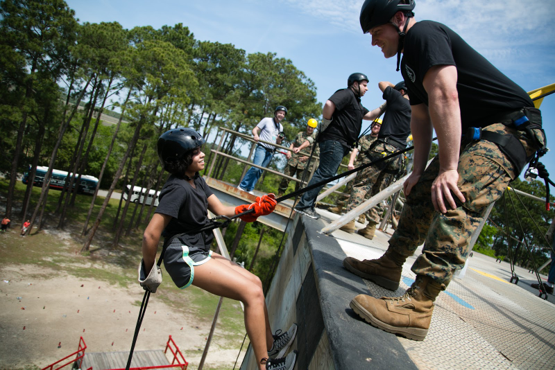 I’m smiling but am secretly terrified on top of the rappel tower.